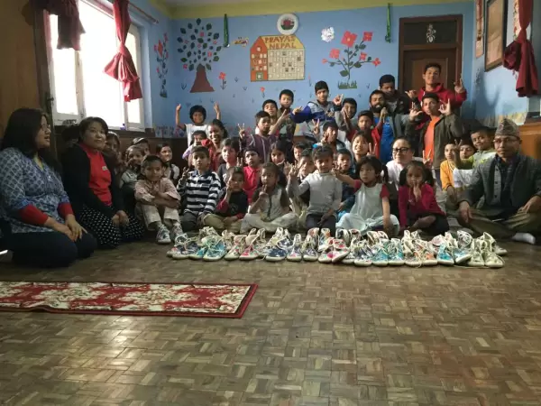 Donating shoes to orphan kids